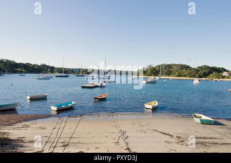 Boats in Quissett Harbor in Falmouth, Cape Cod, Massachusetts, USA on a bright, clear, sunny, blue sky morning Stock Photo