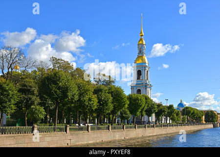 Four story bell tower with tall gilded spire (1755–1758) of St. Nicholas Cathedral and garden. Saint Petersburg, Russia Stock Photo