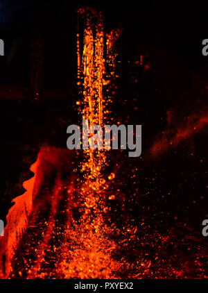 Metal on casting. Metallurgy.  High temperature in the melting furnace. Heavy forging steelmaking plant and steelmaking workshop. Oven. Water curtain. Stock Photo