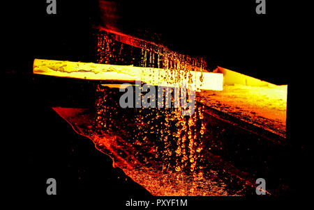 Blast furnace smelting liquid steel in steel mills. Metallurgical plant industrial workshop with open hearth furnace and heavy industry manufacturing  Stock Photo