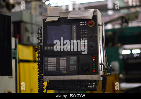 Electrical control panel with buttons on the launch of industrial machines in the production in the inside of the plant Stock Photo