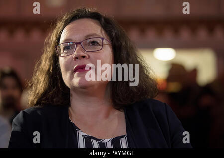 Heuchelheim, Germany. 24th Oct, 2018. 24 October 2018, Germany, Heuchelheim: Andrea Nahles, SPD federal chairwoman, takes her place in the front row at the beginning of an election campaign event. Next Sunday (28.10.2018) a new state parliament will be elected in Hesse. Credit: Boris Roessler/dpa/Alamy Live News Stock Photo