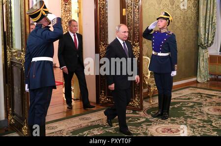 Russian President Vladimir Putin is saluted by Kremlin Guards as he ...