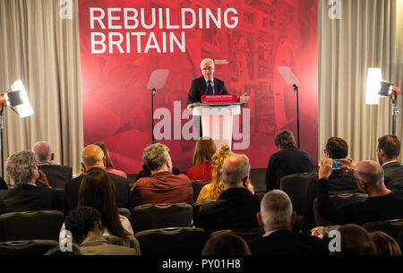 London, UK. 25th October, 2018. Shadow Chancellor, John McDonnell, makes a speech ahead of the Budget on Monday. He lays out Labour's ideas for the economy. He sustained injuries to his face after falling over some rubbish that had been fly-tipped near his home. It was dark and he was returning from a Labour Party meeting.  John McDonnell's pre-budget speech, London, UK-25 Oct 2018. Credit: Tommy London/Alamy Live News Stock Photo