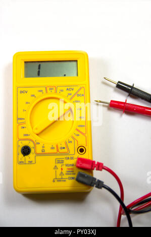 Yellow polymeter that marks 1. on the digital LCD indicating that there is no continuity in the circuit Stock Photo