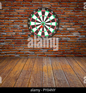 Dartboard on brick wall (miss darts) Stock Photo
