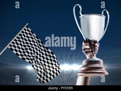 Digital composition of hand of athlete holding trophy in the stadium Stock Photo