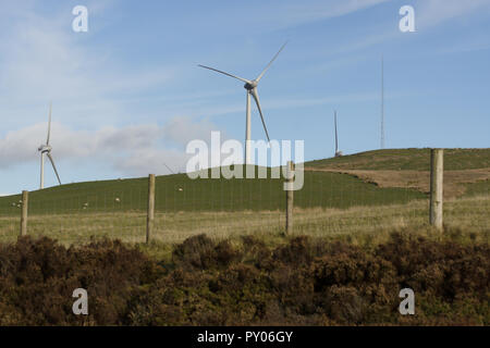 Wind turbines under construction at the Clocaenog Wind Farm they dominate the landscape at the Llyn Brenig reservoir on the Denbigh moors Stock Photo