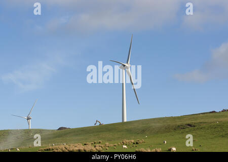 Wind turbines under construction at the Clocaenog Wind Farm they dominate the landscape at the Llyn Brenig reservoir on the Denbigh moors Stock Photo