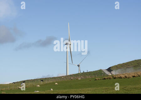 Wind turbines under construction at the Clocaenog Wind Farm they dominate the landscape at the Llyn Brenig reservoir on the Denbigh moors Stock Photo