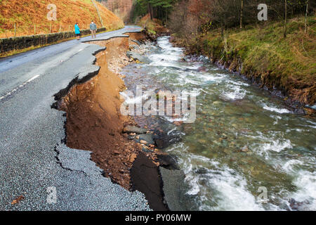 The A591, the main road through the Lake District, completely destroyed by the floods from Storm Desmond, Cumbria, UK. The road was breached in several places by landslides and walls of flood debris twenty feet high. the road will probably be closed for months. Taken on Sunday 6th December 2015. Stock Photo