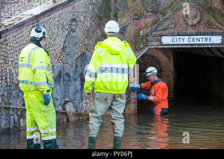 Environment Agency staff involved in pumping out floodwater from Hardwicke Circus in Carlisle, Cumbria on Tuesday 8th December 2015, after torrential rain from storm Desmond. The storm set a new British record for rainfsll totals in a day with 341.4mm falling in 24 hours. Stock Photo