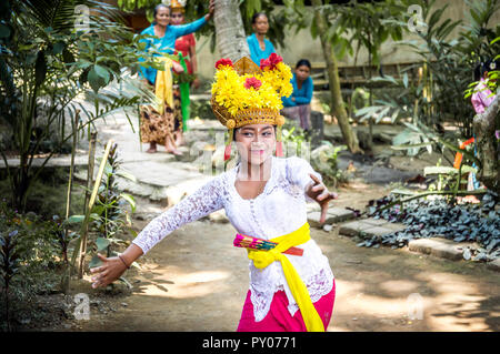 BALI, INDONESIA - APRIL 25, 2018: Balinese dancer wearing beautiful outfit performing on Bali Island, Indonesia Stock Photo