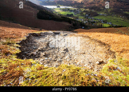 Storm Desmond wreaked havoc across Cumbria with floods and destruction. The super saturated ground failed in many places leaving landslip scars on many of the fellsides, this one is on Stone Arthur above Grasmere, Lake District, UK. Stock Photo