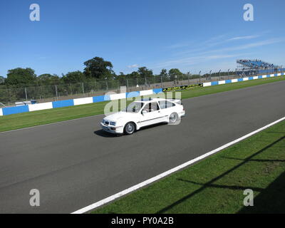 Ford Sierra RS Cosworth in white shown at donnington park race circuit at the RS owners club national day 2017 leading a parade lap mk1 1st generation Stock Photo