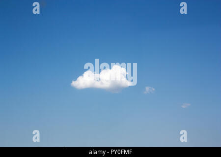 Small summer cloud with the sky completely clear and blue color perfect to accompany some text Stock Photo