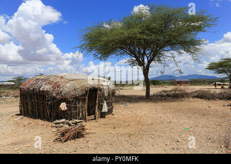 A Maasai village hut near the Samburu Game Reserve,  just west of Archers Post in Kenya. There is a solar powered device on the roof of the hut. Stock Photo
