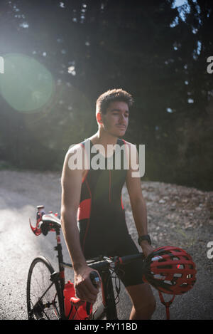 Cyclist in lycra standing by his bicycle, Bosnia and Herzegovina Stock Photo