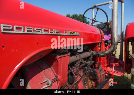 Close-up of oldtimer diesel engine of red Porsche Master tractor Stock Photo