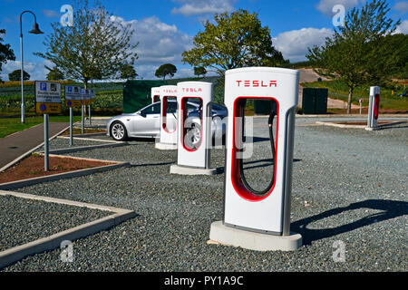 Tesla charging points for electric vehicles at Darts Farm, Exeter, Devon UK