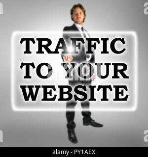 Traffic To Your Website text in a bar on a virtual interface with a businessman activating the button from behind conceptual of SEO and optimising the Stock Photo