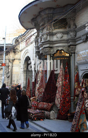 Rugs for sale on the sidewalk at a Turkish outdoor market, Istanbul, Turkey Stock Photo