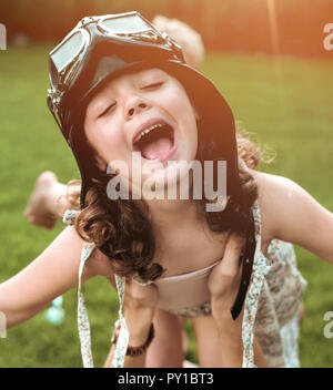 Portrait of a little flying pilot-child having fun Stock Photo