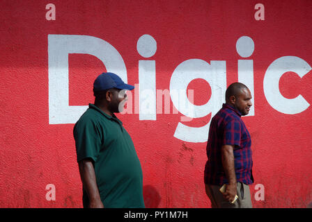 Digicel Sign Painted on wall outside King Kakaruk, Food and Drink Outlet, Okari Street, Port Moresby, Papua New Guinea. Stock Photo