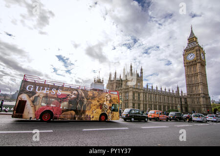 Big Ben and a red double decker during the day. - London, United Kingdom - Big Ben landmark Stock Photo