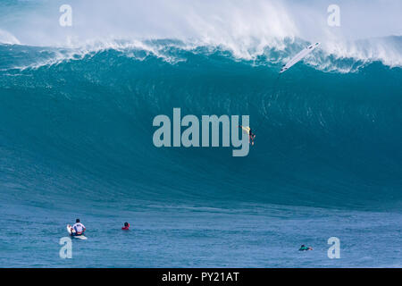 Grant 'Twiggy' Baker falling at the 2016 Eddie Aikau surf contest. Stock Photo