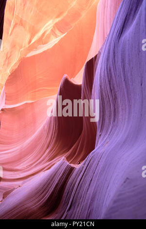 Smooth patterned colorfully illuminated rocks in the Antelope Canyon, Page, Arizona, USA Stock Photo