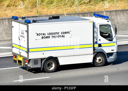 Side view British army military Royal Logistic Corps Bomb Disposal squad emergency support lorry truck driving along English motorway Essex England UK Stock Photo