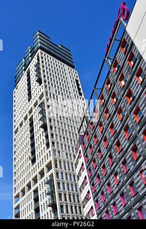 East London skyscraper apartment block & colourful Moxy hotel building façade in new development close to Stratford train station Newham England UK Stock Photo