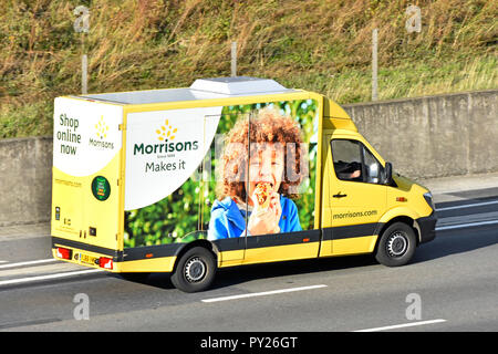 Side of colourful Morrisons internet food grocery supply chain supermarket delivery van home supply service to online food shopping customers Essex UK Stock Photo