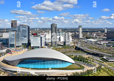 Aerial of urban development Stratford East London station & skyline skyscrapers around Queen Elizabeth olympic park & London Aquatics Centre Newham UK Stock Photo