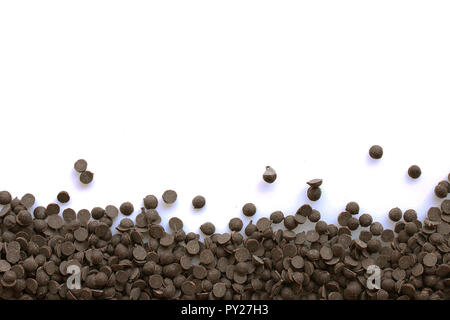 Bottom border of chocolate chips isolated on a white background Stock Photo