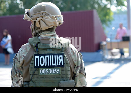 Fully equipped soldiers of KORD (police strike force), standing on a ground, inscription “Police” on bulletproofs. September 5, 2018. Kiev, Ukraine Stock Photo