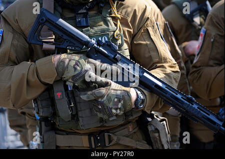 Part of equipment of soldier of KORD (police strike force, Ukrainian SWAT): assault rifle, bulletproof, radio. September 5, 2018. Kiev, Ukraine Stock Photo