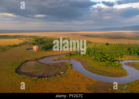 Hot air balloon flying over the Masai Mara, Kenya Stock Photo