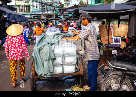 NHA TRANG, VIETNAM - SEPTEMBER 12: A Vietnamese man sells ice at the Cho Dam market in Nha Trang on September 12, 2018 in Nha Trang, Vietnam. Stock Photo