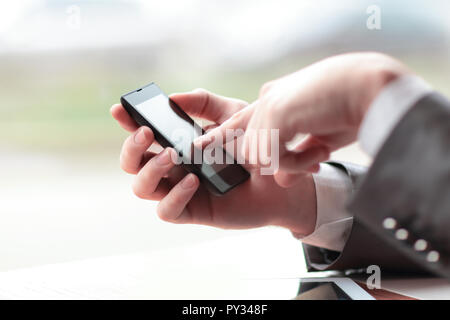 close up.businessman presses his finger on the screen of the sma Stock Photo