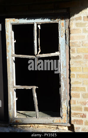 Broken window frame without glass Stock Photo
