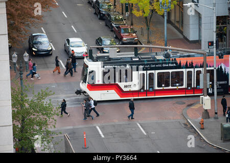 Portland, OR / USA - October 6 2018: Trimet light rail train crossing an intersection in downtown. Stock Photo