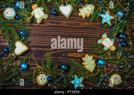 Christmas gingerbread and decorations on a dark wooden background Stock Photo