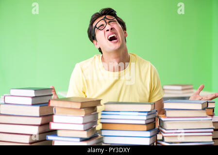 Student with too many books to read before exam Stock Photo