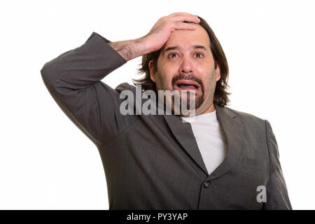 Fat Caucasian businessman looking worried and crying Stock Photo