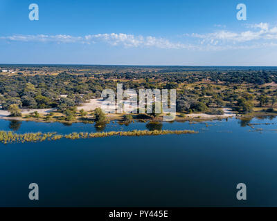 Aerial landscape in Okavango delta on Namibia and Angola border. River with shore and green vegetation after rainy season. Africa aerial landscape. Stock Photo