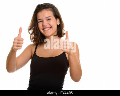 Young happy Caucasian teenage girl smiling and giving thumbs up  Stock Photo