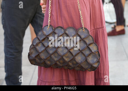 Woman with Louis Vuitton small bag before fashion Tod's show, Milan Fashion  Week street style on September 23, 2016 in Milan Stock Photo - Alamy