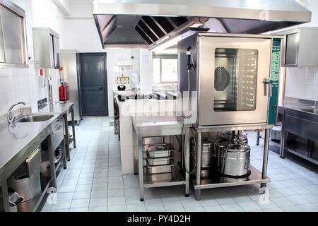 large industrial kitchen made with stainless steel. Stock Photo